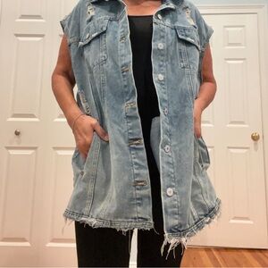 Sleeveless long distressed denim with raw hem vest